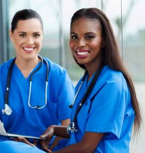 two nurses smiling